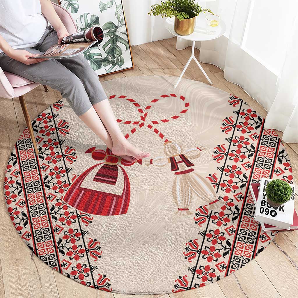 Beige round carpet with red and white folk borders and martenitsa figures