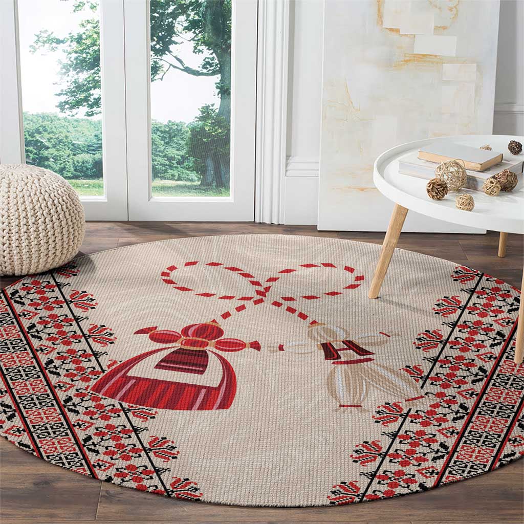 Beige round carpet with central red martenitsa knot and patterned border stripes