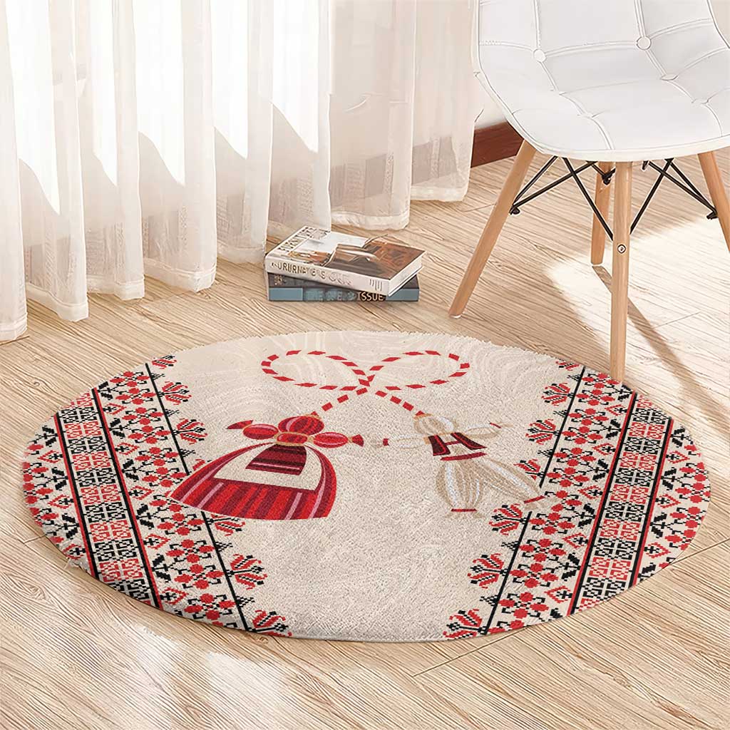 Beige round carpet with red martenitsa bow motif and geometric side border