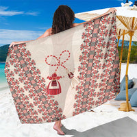 Beige sarong with red-and-black folk stripes and central folk motifs