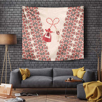 Beige tapestry wall hanging with red folk stripes and central March 1 symbols