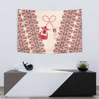 Beige folk tapestry wall hanging with red stripes and angel-like charm figures