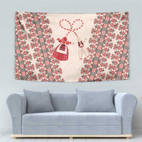 Beige tapestry with red floral stripes and central folk dolls