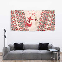 Beige wall tapestry with red border stripes and hanging doll motif