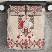 Beige duvet cover with red, white, and dark blue traditional geometric embroidery and pillows