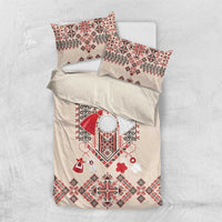 Beige bedding set with red folk embroidery on duvet and two coordinated decorative pillowcases