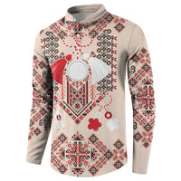 Beige long-sleeve sweatshirt with folk print, high collar, and button placket