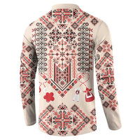 Beige long-sleeve sweatshirt with traditional folk print on back and red heart motif