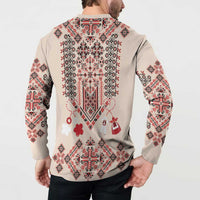 Beige long-sleeve sweatshirt back on model, with folk embroidery print and heart motifs