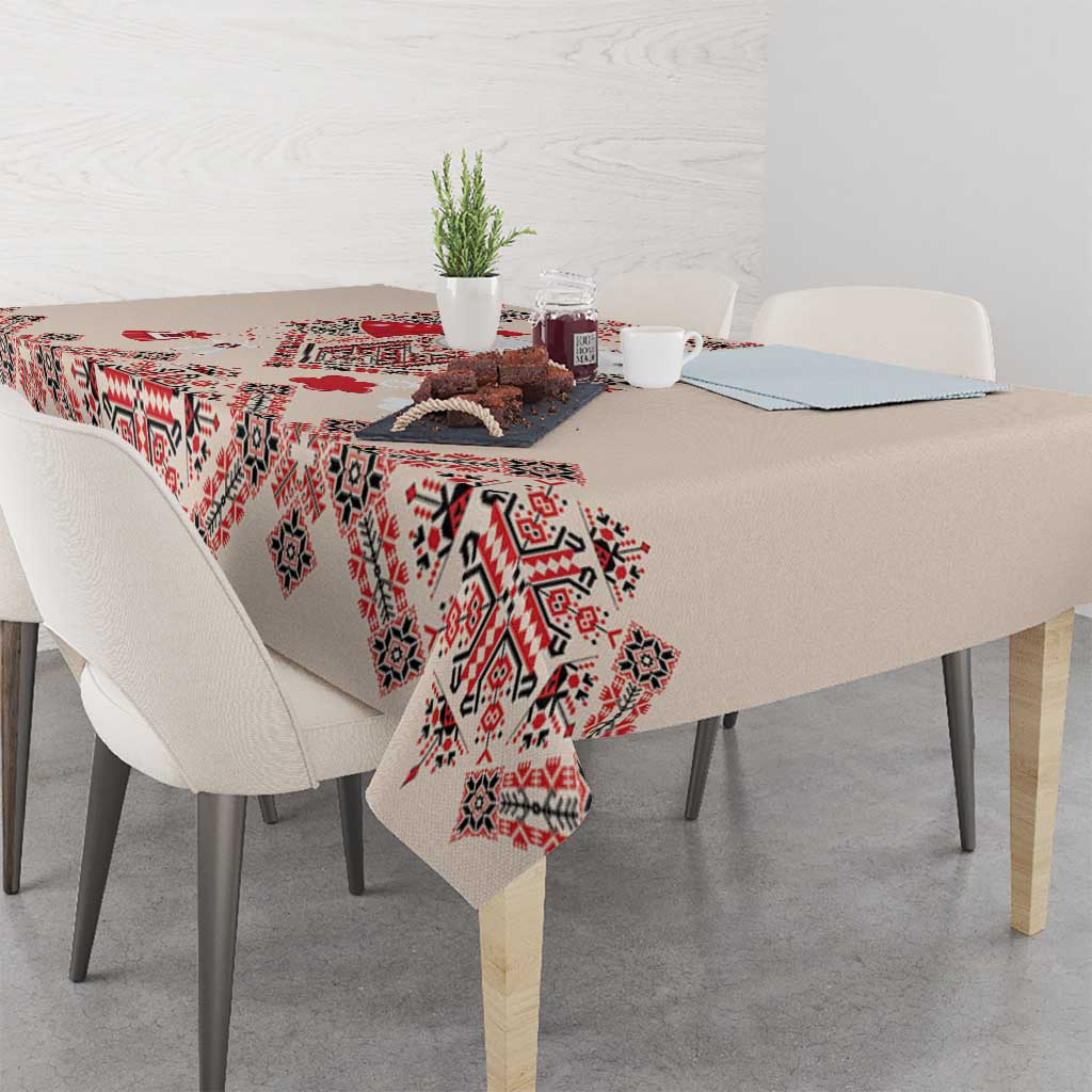 Beige tablecloth with red, navy, and white geometric folk embroidery pattern