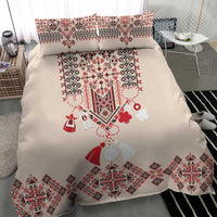 Beige bedding set with duvet and two matching pillowcases, centered red geometric design