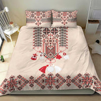 Beige duvet with two pillowcases featuring red folk embroidery and decorative hanging motifs