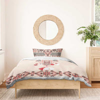 Beige duvet and pillowcases with red folk embroidery and geometric pattern accents