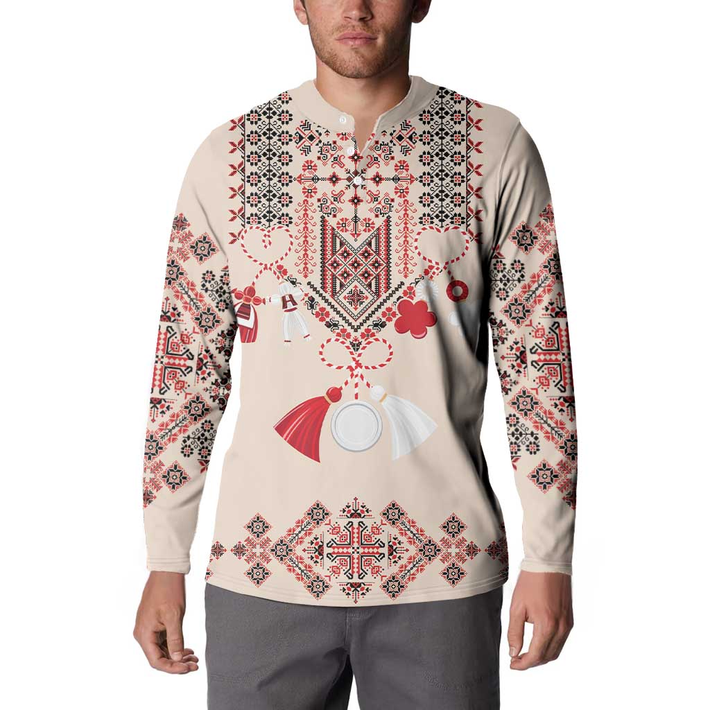 Beige button-placket sweatshirt with long sleeves and red/white folk embroidery, on model