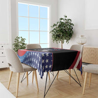 4th of July tablecloth draped over table edge with blue star field and red-white stripes