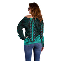 Women’s teal off-shoulder sweater with vertical turquoise border pattern, long sleeves