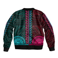 Teal-and-pink dashiki bomber jacket with ribbed cuffs, crew collar, and Polynesian motif