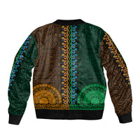 Green and gold bomber jacket, back panel with tapa/dashiki motifs and ribbed hem