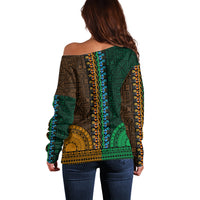 Women’s off-shoulder dashiki sweater, back print in green and gold tapa-style pattern