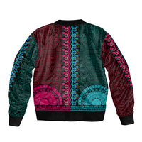 Unisex bomber jacket back with teal and pink geometric tapestry pattern, ribbed cuffs