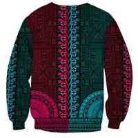Back view dashiki tapa sweatshirt in teal and magenta with geometric blocks and central trim.