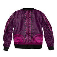 Pink bomber jacket with ornate African tapa/dashiki pattern, back view, ribbed hem and cuffs.