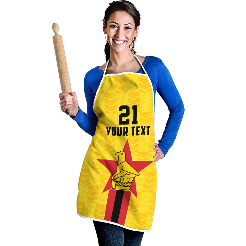 Yellow custom apron on model, '21 YOUR TEXT' graphic with star bird emblem