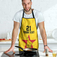Yellow custom apron worn by cook, '21 YOUR TEXT' star bird emblem