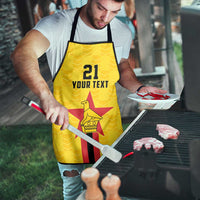 Yellow custom apron on outdoor grill, '21 YOUR TEXT' star bird emblem