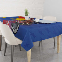 Blue tablecloth with eagle and red-white emblem graphic across table