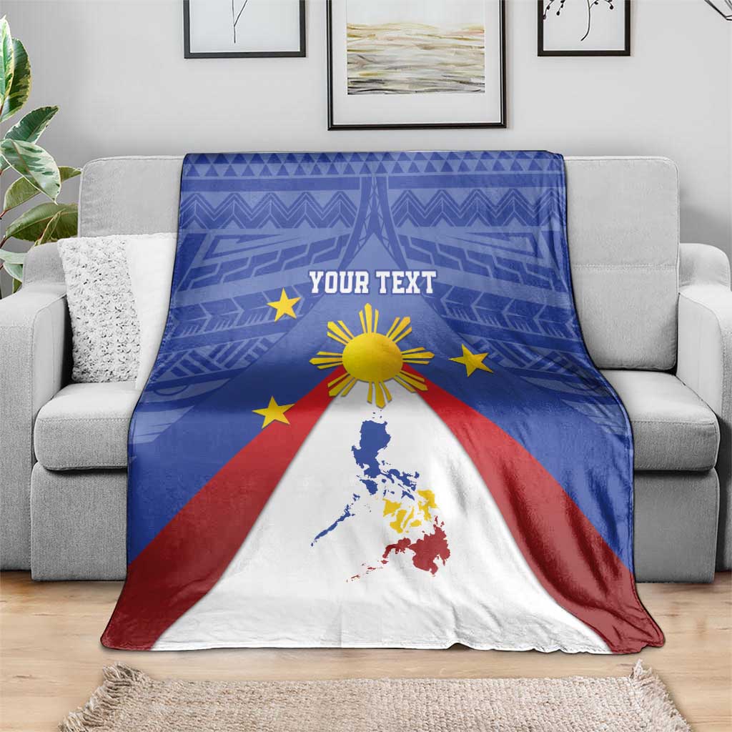 Folded blue Philippines map blanket with eight-rayed sun, yellow stars, red and white design