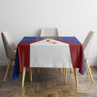 Blue tablecloth with red-and-white Philippines map and sun emblem on dining table