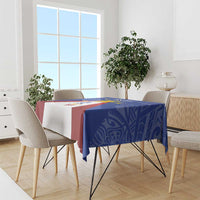 Blue tablecloth with colorful Philippines map-and-sun motif on a dining table