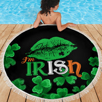 Black round beach blanket with 'I'm Irish' green lips and four-leaf clover pattern, white fringe