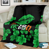 Black blanket featuring green clovers and “I'm Irish” with lip print graphic
