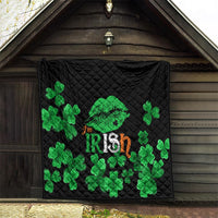 Black quilt blanket with green clover pattern and Irish-themed design, quilted fabric.