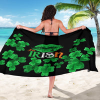 Black sarong draped across back with green clovers and “Irish” lettering