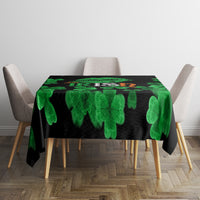 Black St. Patrick's Day tablecloth with green clover pattern on dining table