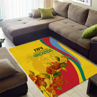 Gold area rug with 1974 Grenada print, bougainvillea blossoms, and sweeping rainbow stripes