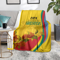 Yellow Grenada flag-style blanket with 1974 text, autumn flowers, and curved red-green-blue stripes