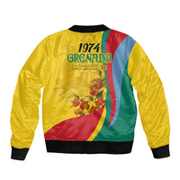 Gold bomber jacket with 1974 Grenada graphic, multicolor flag stripe, ribbed hem cuffs