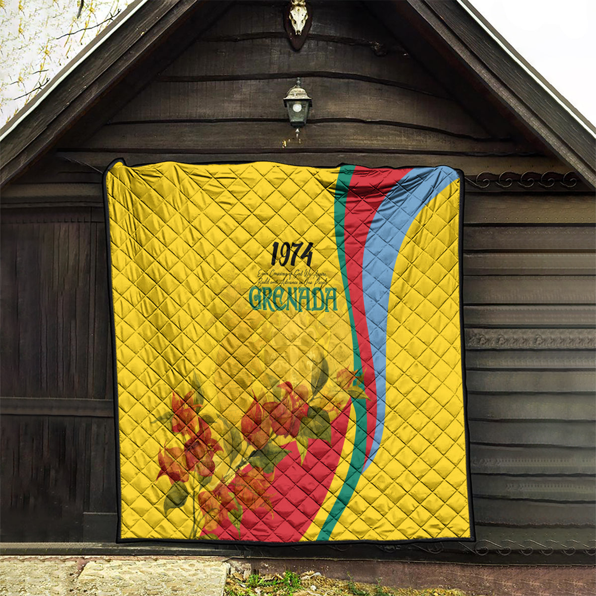 Yellow quilt with quilted diamonds, Grenada 1974 emblem, red and blue curve, floral motif