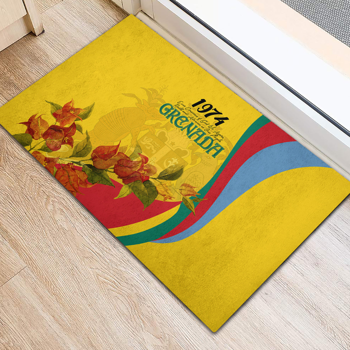 Yellow rubber doormat with Grenada 1974 logo, multicolor curved stripes, and floral art