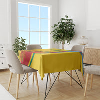 Gold flag-style Independence Day tablecloth draped on a dining table