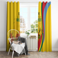 Yellow Grenada flag-style window curtains with “1974” and bougainvillea flowers printed on fabric.