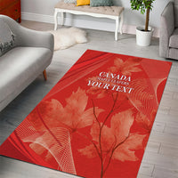 Red area rug featuring Canada Mapleleafers text and maple leaves with fan-like lines