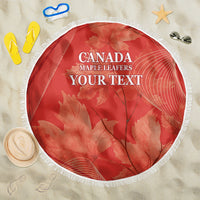 Red round beach blanket with white fringe, Canada Maple Leafers and maple leaf graphic