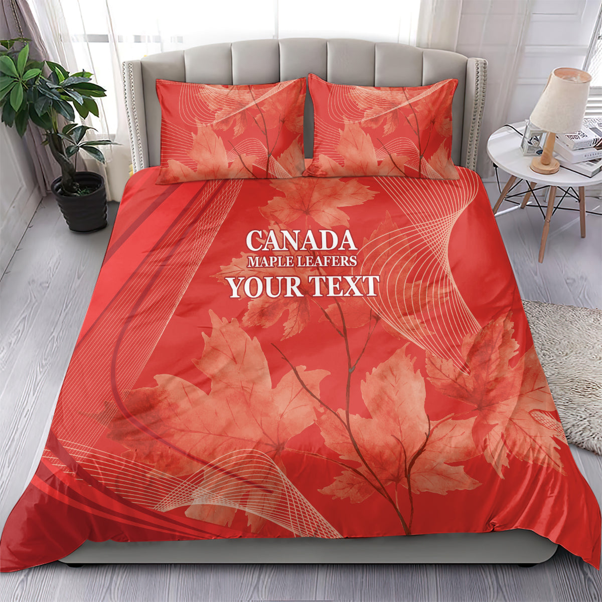 Red bedding set on bed: duvet cover and two pillow shams with maple leaf pattern