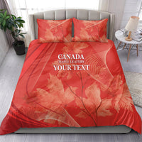 Red bedding set on bed: duvet cover and two pillow shams with maple leaf pattern