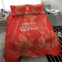 Red duvet cover with two matching pillow shams featuring maple leaf graphics and text